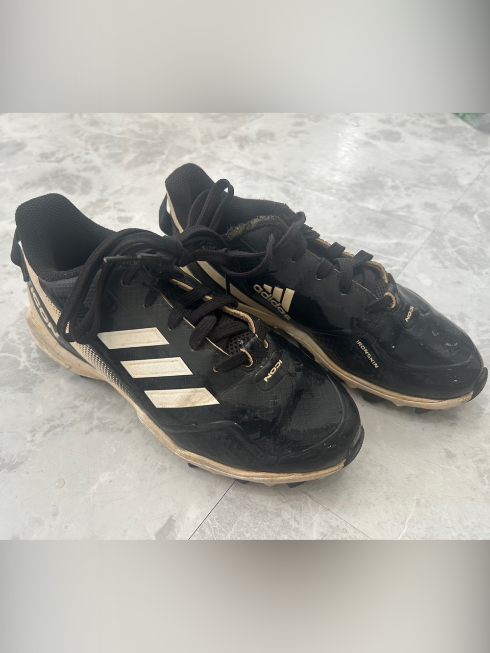 adidas Black and Cream Athletic Cleats